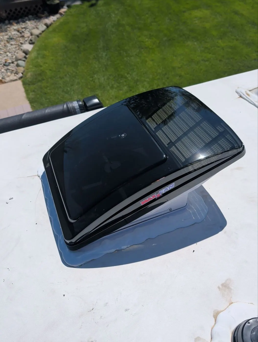 New MaxxFan powered roof vent sitting on an RV roof ready to install