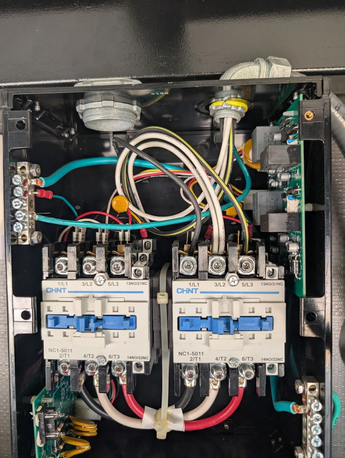 Open RV automatic transfer switch showing dual contactors and wiring during a repair