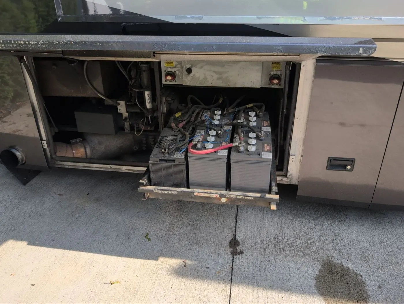 House battery bank on a slide-out tray under a motorhome