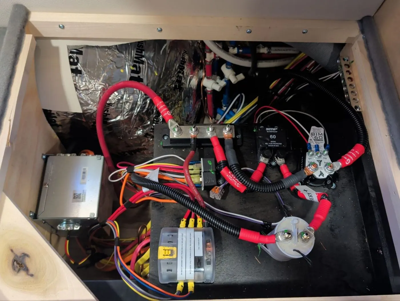 Battery Isolation Manager, 60 amp breaker, busbar, and fused distribution installed for a lithium conversion