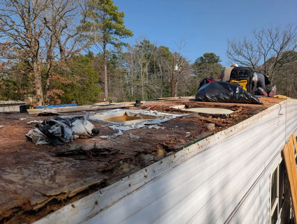 Severely rotted RV roof decking exposed during a full roof replacement